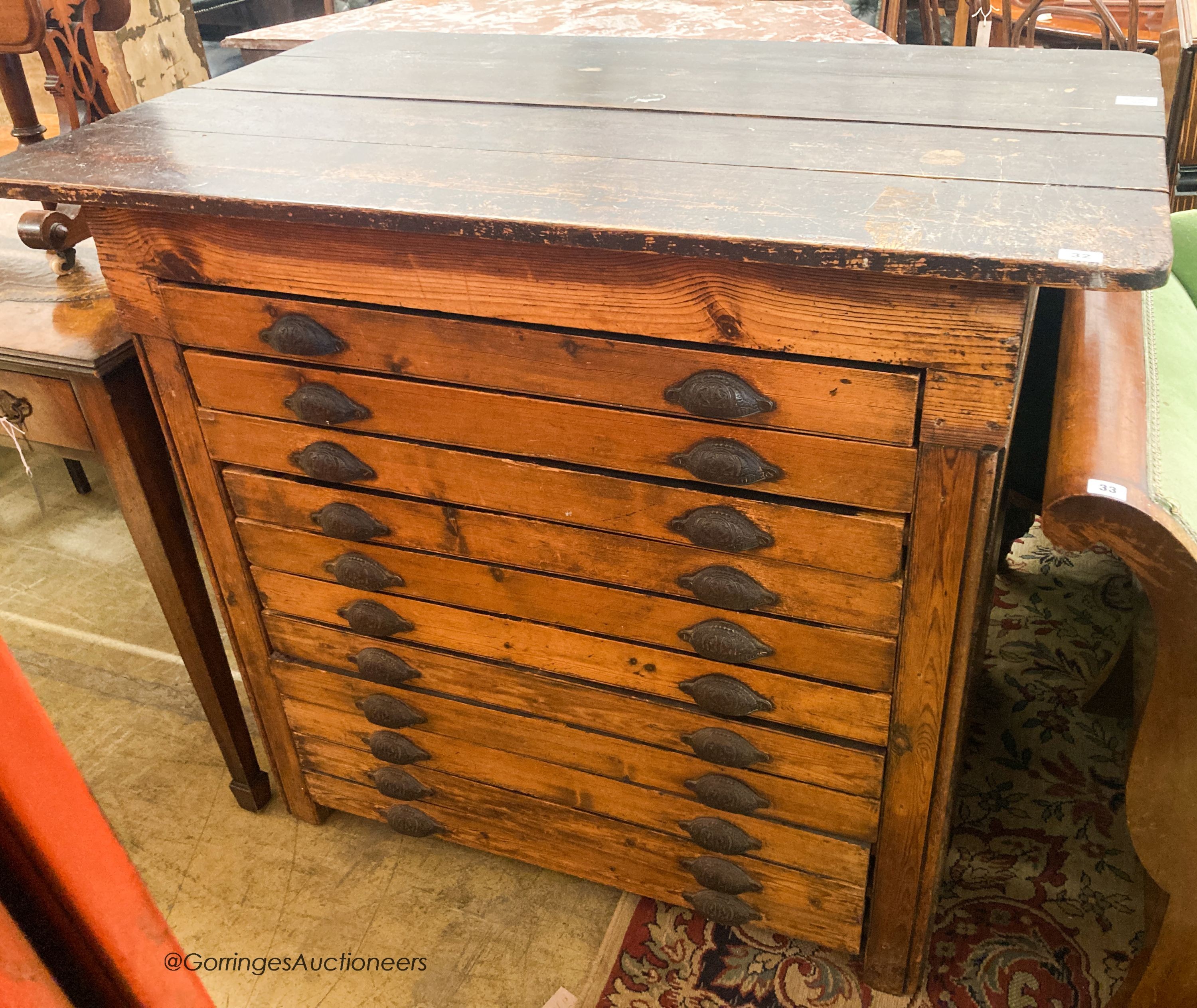 A late Victorian pine eleven drawer plan chest, W.118cm D.74cm H.101cm